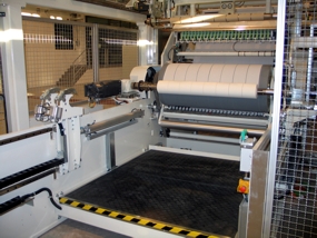 Surface-center winder for airlaid paper
